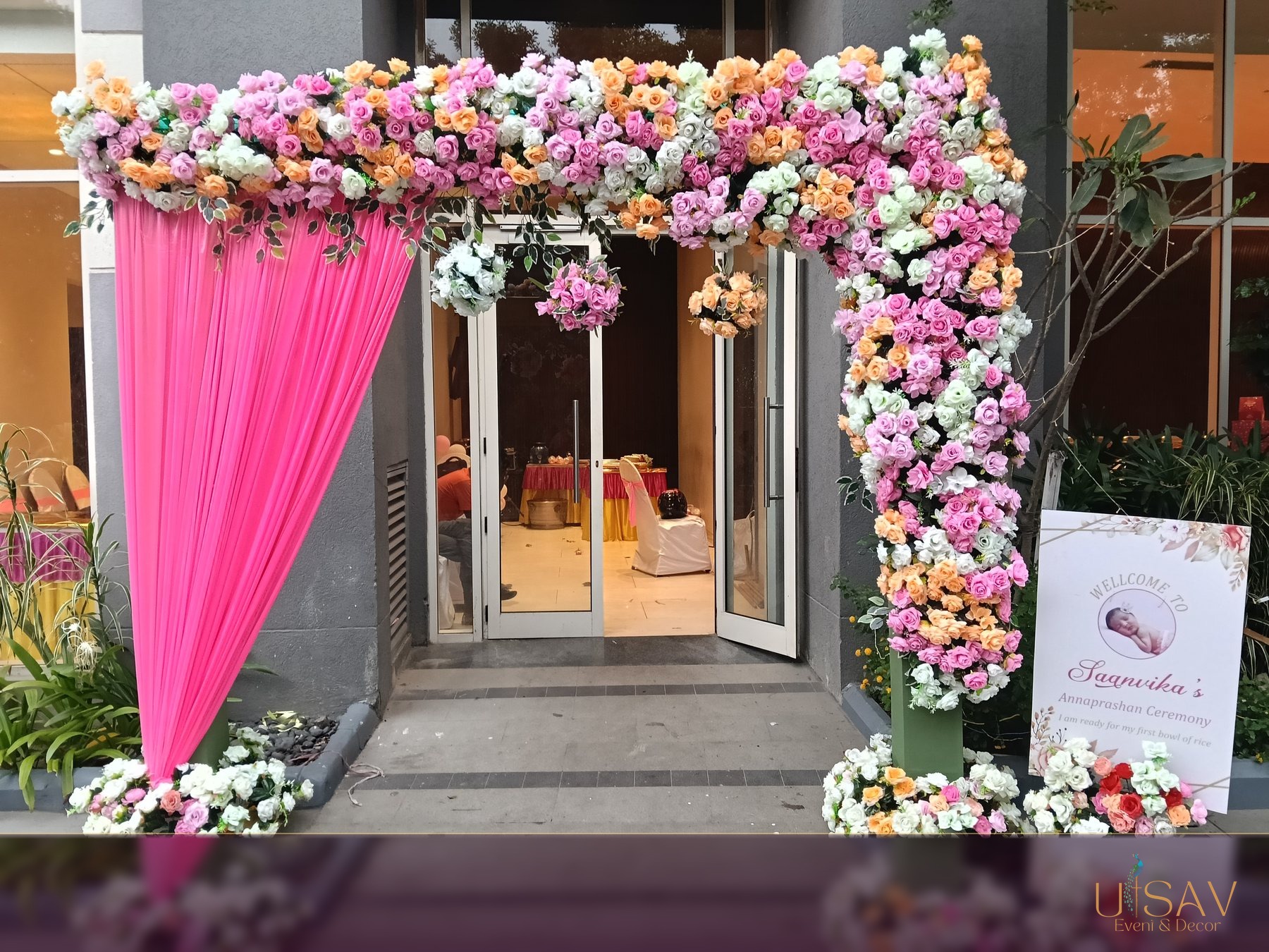 Pink and white floral welcome arch