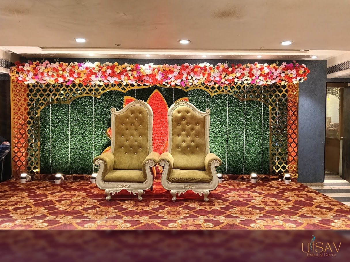 Reception floral stage with ornate seating